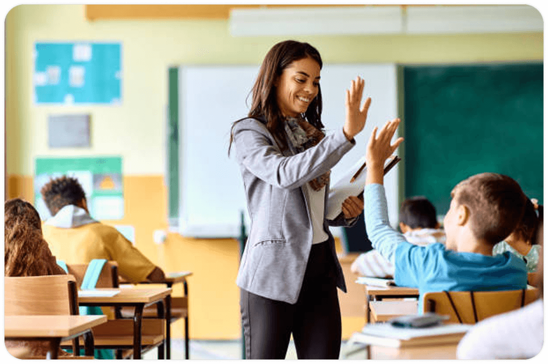 Teacher woman teaches two students in a classroom